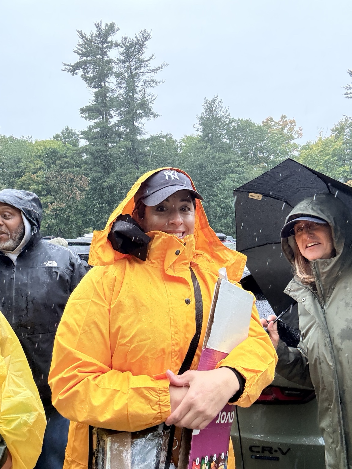 Hawks supporters gathered in heavy rain